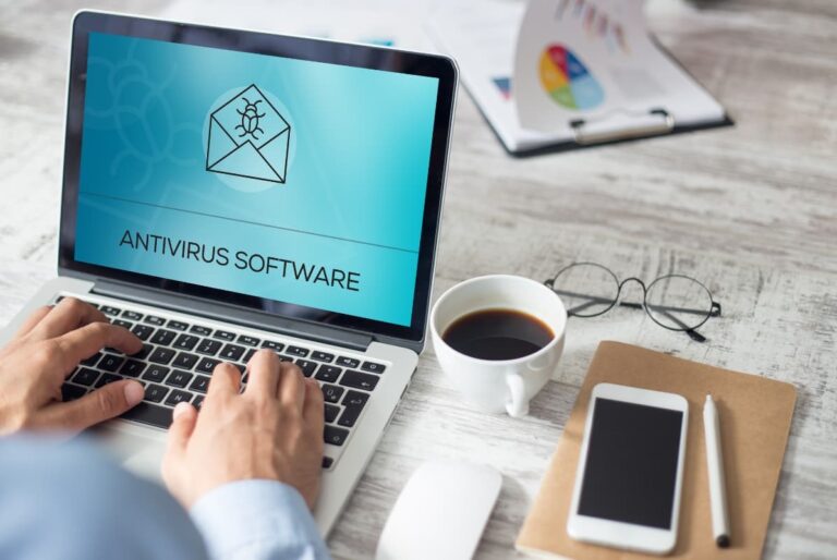A person using a laptop displaying Antivirus Software