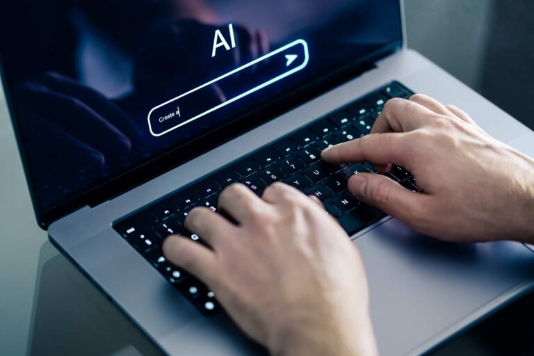 Person using an AI browser assistant on a laptop.