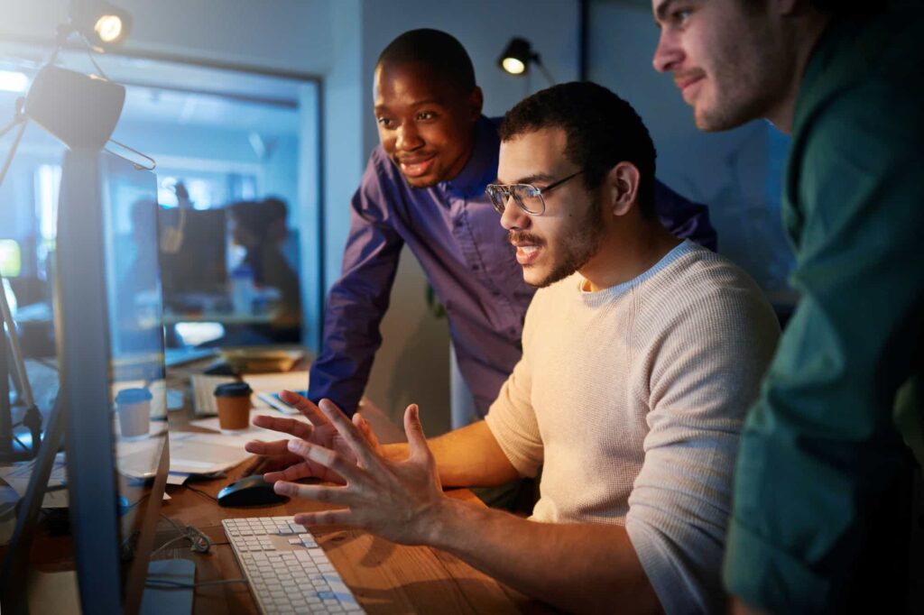 AI development team reviewing training data for fairness and accuracy.