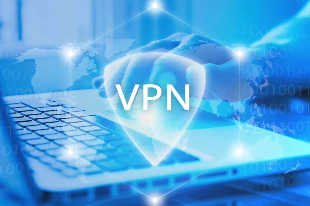 A person uses a laptop with a VPN icon, emphasizing the need to check local VPN laws, as legality varies by country.

