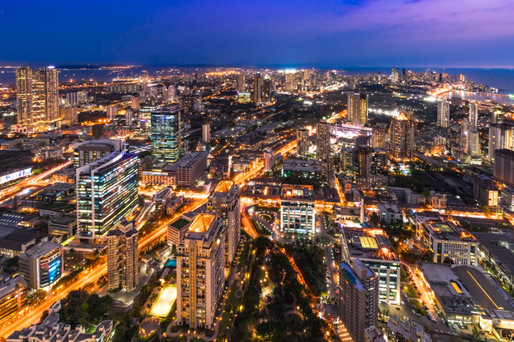 Aerial view of a modern city with interconnected buildings and infrastructure.