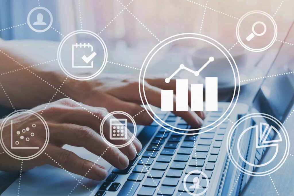 Man typing on a laptop with digital analytics charts and data visualizations overlay.