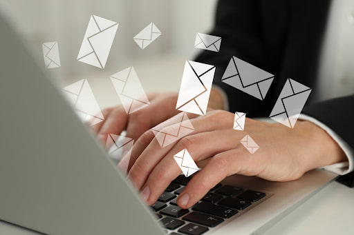 Several digital email envelopes grouped on a screen, representing spam emails sent from a spoofed address.