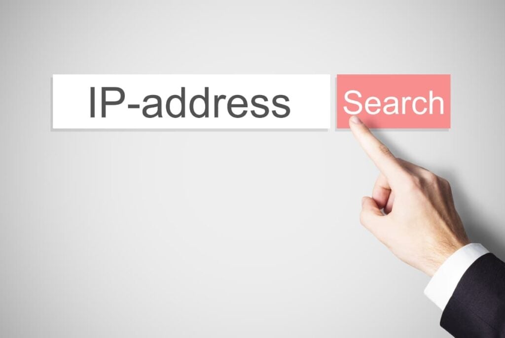 A finger pointing a a search bar for ip addresses