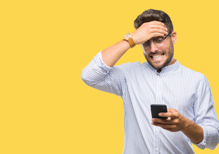 man texting using smartphone