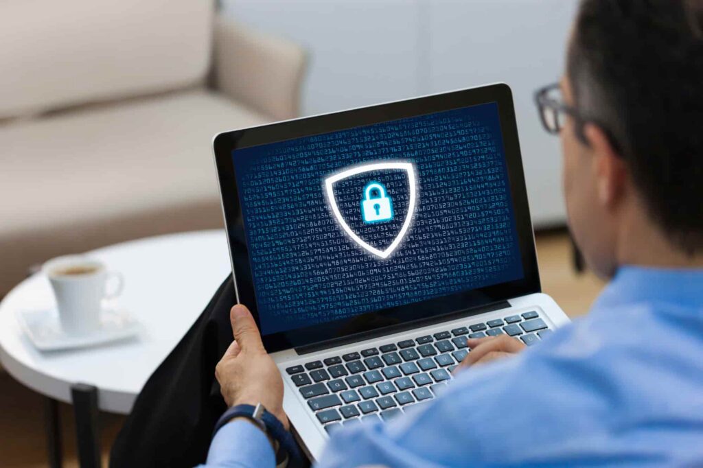 Laptop screen displaying a lock and security icon, symbolizing data protection and digital security.